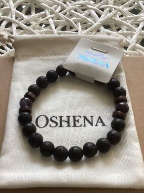 Oshena Black Lava Bead Stretch Bracelet with Amethyst beads.